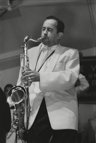 Paul J. Hoeffler, Paul Gonsalves at Newport Jazz Festival, 1956
Gelatin silver print; printed later, 6 x 9 in. (15.2 x 22.9 cm)
Paul Gonsalves (1920-1974), a tenor saxophonist best known for appearing at the 1956 Newport Jazz Festival and playing a 27-chorus solo in the middle of "Diminuendo and Crescendo in Blue", a performance credited with single-handedly revitalizing Ellington's waning career. Signed by the photographer.
7393
$300