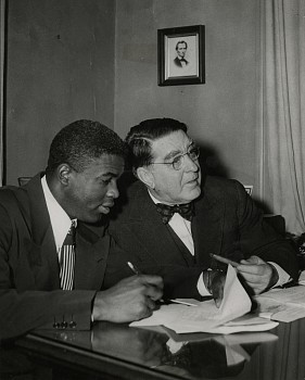 Work: Jackie Robinson signs his contract