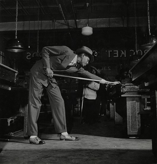 George Strock, Satchel Paige Playing Pool. NY, NY, 1941
Vintage gelatin silver print, 10 3/4 x 10 3/8 in. (27.3 x 26.4 cm)
Annotated "Satch, only a fair pool player, usually loses more than he wins. Flat feet?" in pencil, with photographer's credit stamp and Time/Life credit and file stamps in ink verso.
Illustrated: Life, June 2, 1941, p. 92 [using this print].
5728