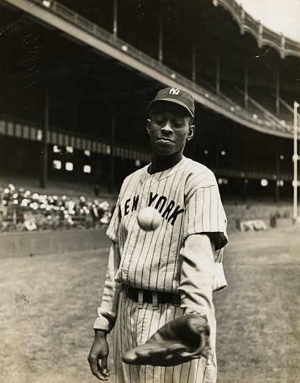 George Strock, Satchel warms up before the game. His uniform resembles the Yankees' outfit, 1941
Vintage gelatin silver print, 13 7/16 x 10 1/2 in. (34.1 x 26.7 cm)
Mounted on board; annotated in ink and stamped and dated by Time and LIFE on mount verso. (Similar stamps and annotations probably on print verso but only a fraction can be seen because of print lifting off mount at bottom.)
Illustrated: LIFE, June 2, 1941, p. 90 [using this print].
8498